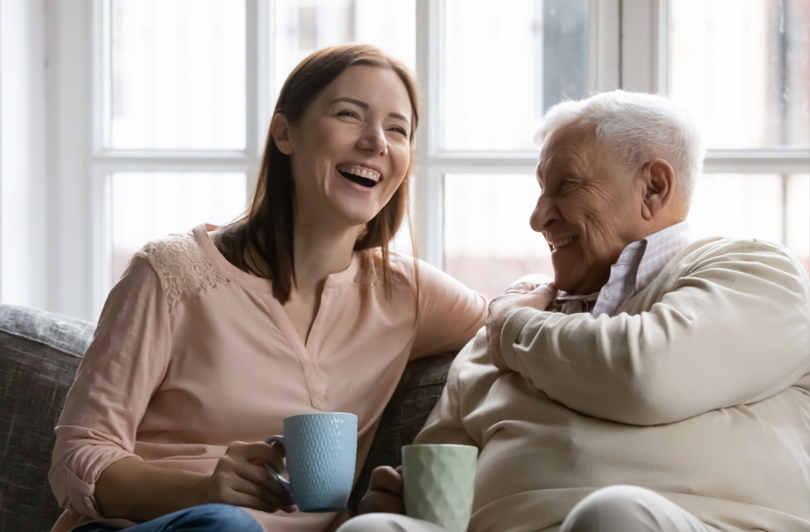 A daughter enjoying quality time with her father during her memory care visit.